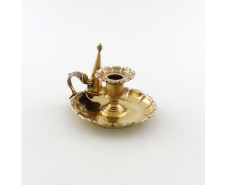 A George IV silver-gilt small chamber stick, by Matthew Boulton, Birmingham 1827, circular fluted form, leaf capped scroll ha