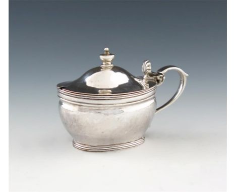 A George III silver mustard pot, by Hester Bateman, London 1787, oval form, scroll handle, dome hinged cover with an urn fini