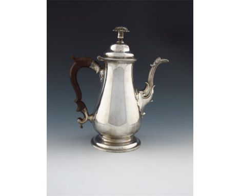 An 18th century silvered brass coffee pot, with pseudo marks, circa 1770, tapering circular form, scroll handle, shell and sc