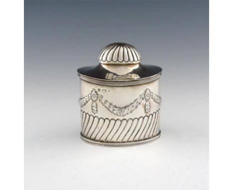 An Edwardian silver tea caddy, by George Unite, London 1901, oval form, part-fluted decoration below swags and medallions, th