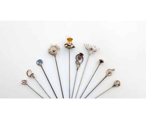 A collection of ten Charles Horner silver hat pins, Chester, various dates, including: a yellow paste decorated thistle with 