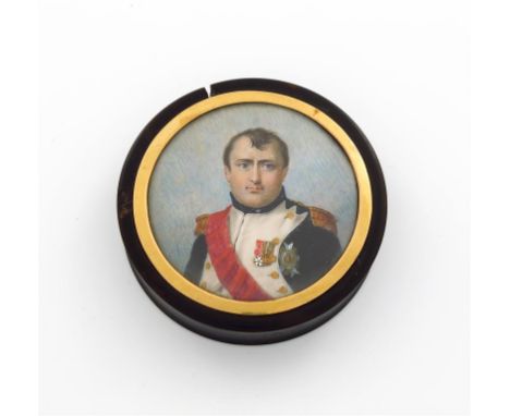 λ A 19th century French tortoiseshell portrait miniature snuff box, circular form, the pull-off cover with a portrait of Napo