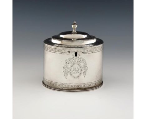 A George III silver tea caddy, by Hester Bateman, London 1783, oval form, bright-cut decoration, beaded borders, domed hinged