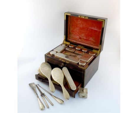 A Victorian silver-gilt mounted travelling dressing table set, by William Wright and Frederick Davis, retailed by S.Mordan an