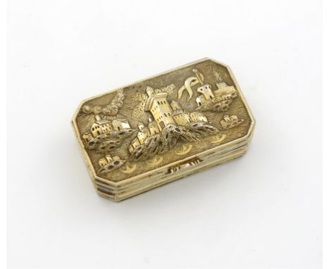 A 19th century silver-gilt snuff box, unmarked, probably continental,  rectangular form, canted corners, the hinged cover wit