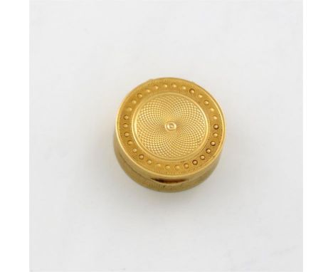 An early 19th century gold vinaigrette, circular form, engine-turned decoration, with a punch bead border, the hinged grille 