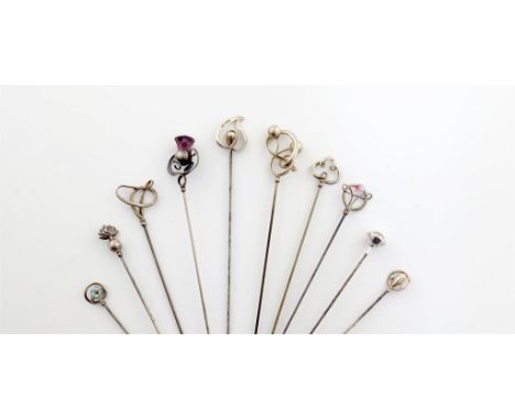 A collection of ten Charles Horner silver hat pins, Chester, various dates, including: one with a grenade finial, one with a 