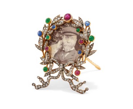 A MULTI GEM SET PICTURE FRAME The rose cut diamond laurel wreath frame with cabochon ruby, emerald and sapphire berries, with