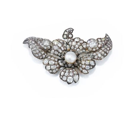 A LATE 19TH CENTURY PEARL AND DIAMOND FLOWER BROOCH  CIRCA 1890 The old mine and old European cut diamond flower, centrally s