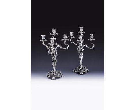 A PAIR OF FRENCH SILVER FOUR LIGHT CANDELABRA CARDEILHAC, PARIS, MINERVA MARKS, EARLY 20TH CENTURY With foliate chase baluste