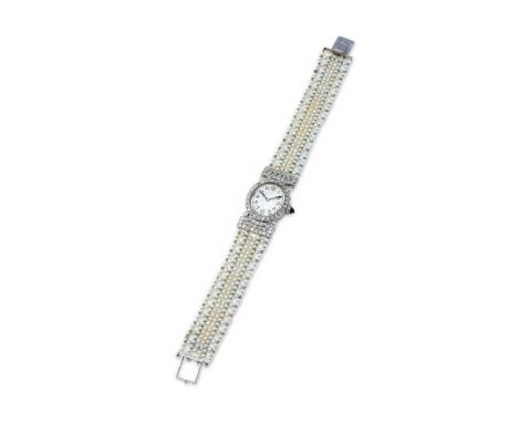 AN EARLY 20TH CENTURY DIAMOND COCKTAIL WATCH CIRCA 1920 The oval silvered dial with black Arabic numerals and blued steel han