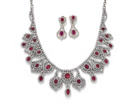 DIANOOR, A RUBY AND DIAMOND NECKLACE AND EARRING SUITE  Designed as a graduated bib of opposing articulated drop shaped secti