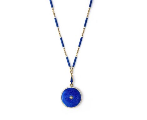 AN EDWARDIAN ENAMEL LOCKET PENDANT NECKLACE  The circular locket with royal blue guilloché enamel within a white enamel borde