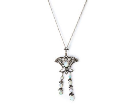 AN EDWARDIAN OPAL AND DIAMOND PENDANT/BROOCH  The openwork cartouche set with cabochon opals and rose cut diamonds, suspendin