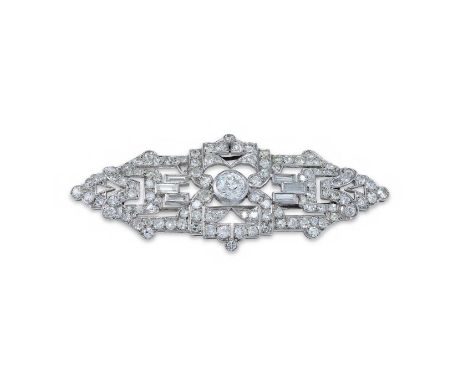 AN ART DECO DIAMOND BROOCH  CIRCA 1930 The openwork tapered plaque collet set with a central old European cut diamond within 