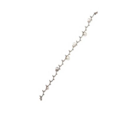 A CULTURED PEARL AND DIAMOND BRACELET  Composed of brilliant cut diamond set tendrils interspersed with six baroque cultured 