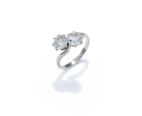 A DIAMOND 'TOI ET MOI' RING Set with two old European cut diamonds, weighing 1.30 and 1.32 carats, to a crossover design shan
