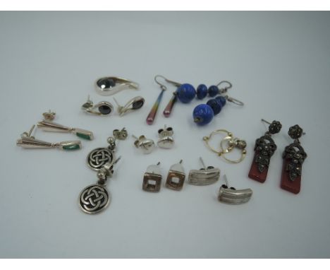 Several pairs of silver and white metal earrings for pierced ears, including two pairs by Kit Heath, rainbow titanium, lapis 