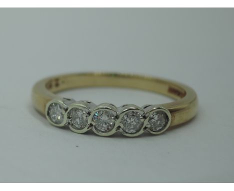 A five diamond dress ring, total approx 0.25ct in collared mounts on a 9ct gold loop, size M &amp; 2.1g