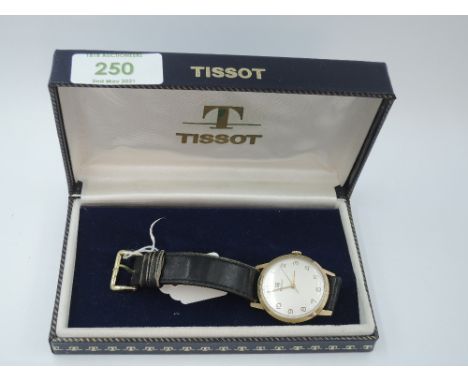 A gent's 1960's 9ct gold wrist watch by Tissot having gilt Arabic numeral dial to frosted face with sweeping seconds, present