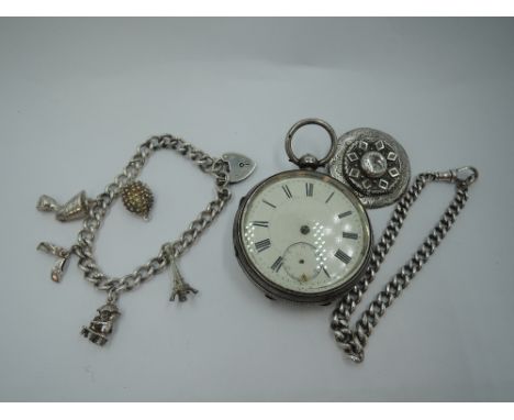 A silver charm bracelet having five silver &amp; white metal charms an HM silver watch chain bracelet, circular brooch and a 
