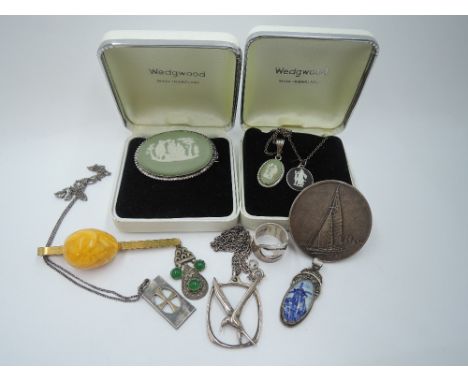 A small selection of white metal and silver jewellery including Wedgwood pendants and brooch, Delph pendant, Scandinavian pen