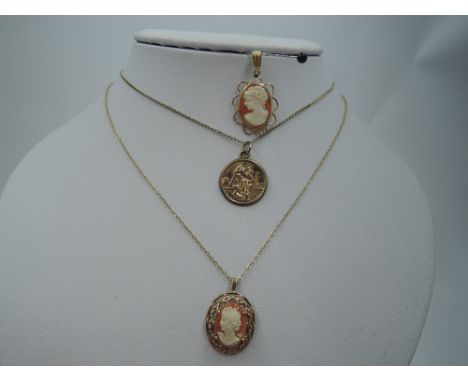 A 9ct gold St Christopher pendant on a 9ct gold chain, (AF), a cameo pendant on a 9ct gold chain and another similar pendant,