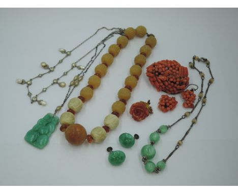 A small selection of vintage costume jewellery including coral brooch with matched earrings (AF), carved jade pendant in form