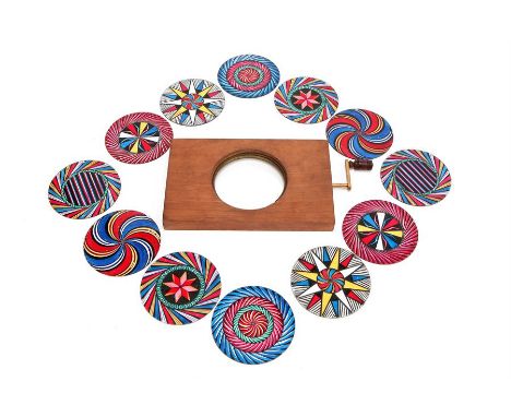 An Interchangeable Hand-Painted Chromotrope Magic Lantern Slide Set,C.1880, English, unsigned, comprising of a mahogany & bra