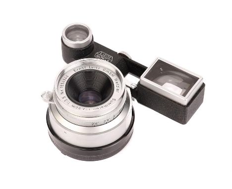 A Leitz Summaron f/2.8 35mm Lens,1958, with ocular attachment, chrome, serial no. 1554944, body, VG-E, elements, VG, some lig
