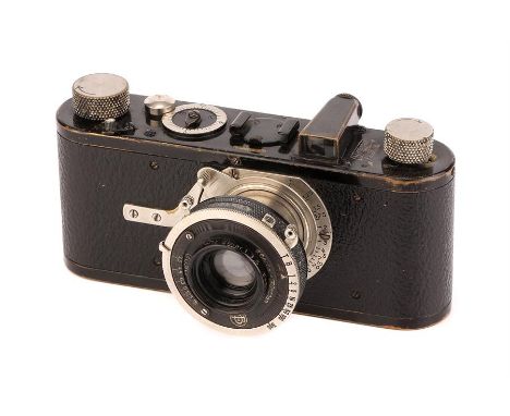 A Leica Model Ib Rim-Set Compur Camera,1930, black, serial no. 34592, with Leitz Elmar f/3.5 50mm lens, body, G, shutter work