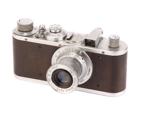 A Leica Standard Model E Camera,1936, chrome, serial no. 185617, with Leitz Elmar f/3.5 50mm lens, 1937, chrome, serial no. 3