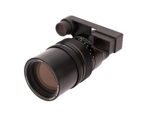 A Leitz Elmarit-M f/2.8 135mm Lens,1989, with ocular attachment, black, serial no. 3486753, body, VG-E, elements, VG, some li