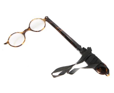 A Rare Bifocal Lorgnette,cemented bifocal lenses, in tortoiseshell frame