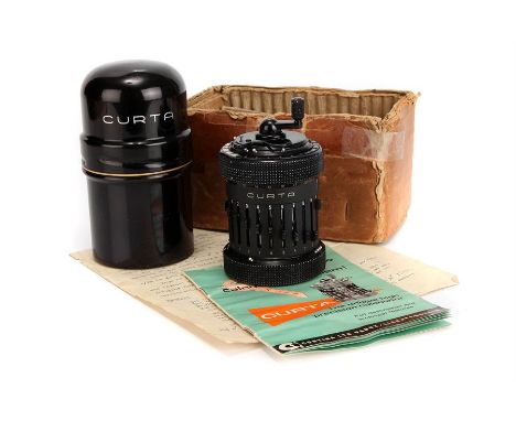 A Curta Calculator Model 2,in black, serial no. 501904, in black metal case with original instructions, hand written notes & 