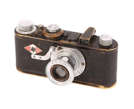 A Leica Model Ia Camera,1930, black, serial no. 26611, with Leitz Elmar f/3.5 50mm lens, chrome, body, F-G, shutter working, 