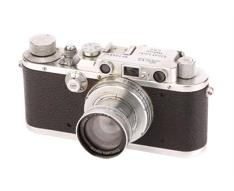 A Leica III Rangefinder Camera,1934, bright chrome, serial no. 135855, with Leitz Summar f/2 50mm lens, 1934, chrome, serial 