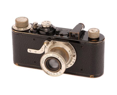 A Leica Model Ia Camera,1930, black, serial no. 56765, with Leitz Elmar f/3.5 50mm lens, nickel, body, G-VG, shutter working,