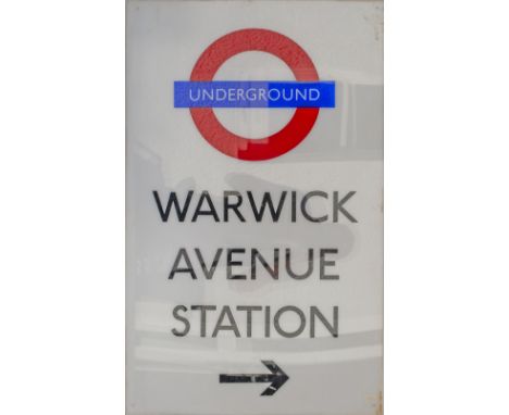 London Underground station direction sign WARWICK AVENUE STATION with right pointing arrow. Two layer perspex that would have