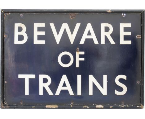 LNER enamel sign BEWARE OF TRAINS. In very good condition mounted in a wooden frame. Enamel measures 27in x 18in. Ex Foxton S