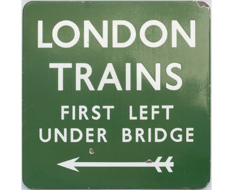 BR(S) FF enamel railway sign LONDON TRAINS FIRST LEFT UNDER BRIDGE with left facing arrow. In very good condition with a few 