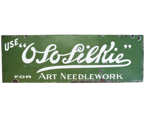 Advertising enamel sign OSOLIERIE FOR ART NEEDLEWORK. In good condition with minor chipping, measures 72in x 24in.