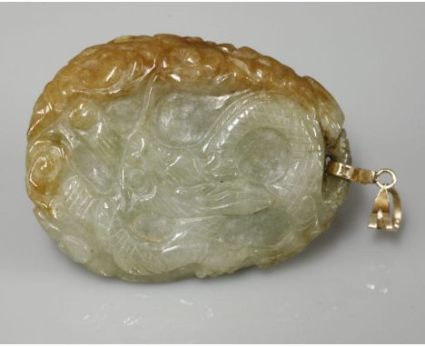 A carved jade pendant, depicting a dragon on one side and two bats on the reverse, marked 585 14K