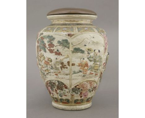 A Kyoto 'Satsuma' vase, circa 1875, thrown and moulded with boys playing in a garden bordered by bamboo between flowers and b