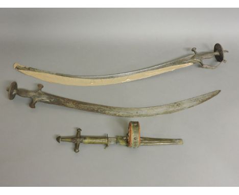 Two Indian talwars, longest 84cm, and a Tuareg arm dagger and scabbard, 37cm long