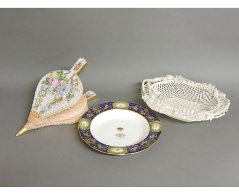 A Spode decorated soup bowl, centred with a coronet and monogram, with gilt vine leaves and rose borders, a bellows form wall