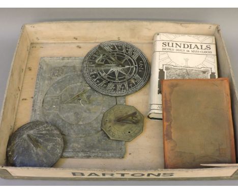 A lead sundial, dated 1750?, 21 x 25cm, another lead sundial, 11cm diameter, two others, together with two books on sundials