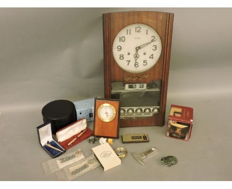 An Acctim 31 day wall clock, with day and date, a Citizen talking clock, a small wooden plaque mounted barometer, a barometer