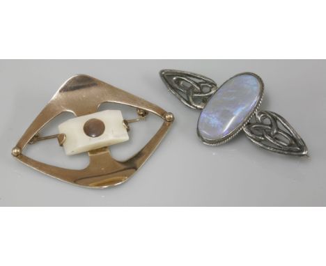 A Celtic style black opal or black opal doublet brooch, and an Art Deco Czechoslovakian mother of pearl silver gilt brooch, 9
