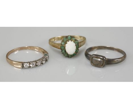 A 9ct gold opal and emerald oval cluster ring, a 9ct gold half hoop ring, a gold Georgian memorial ring, a gold ruby set stic